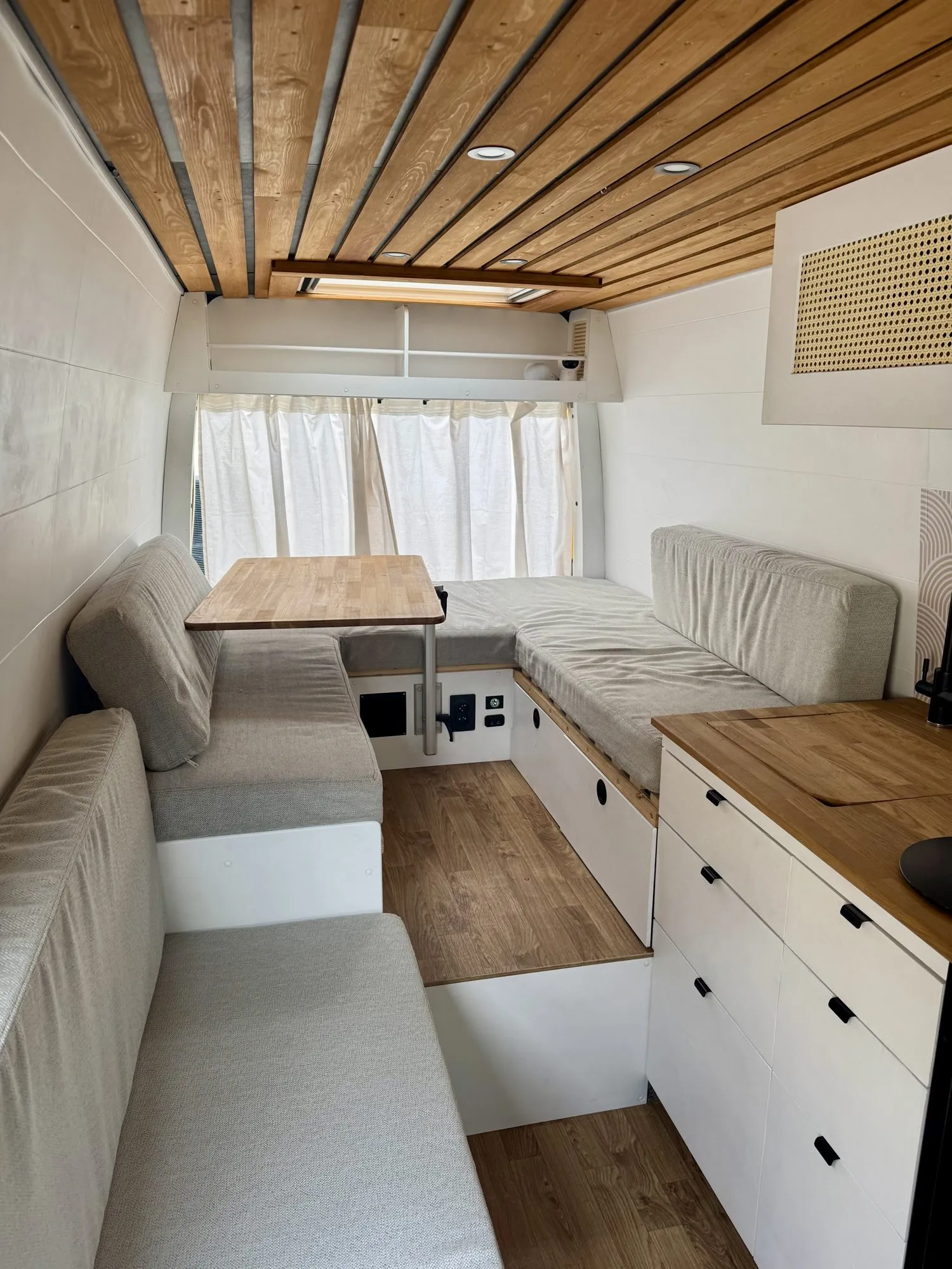 U-shaped lounge at the back of the van